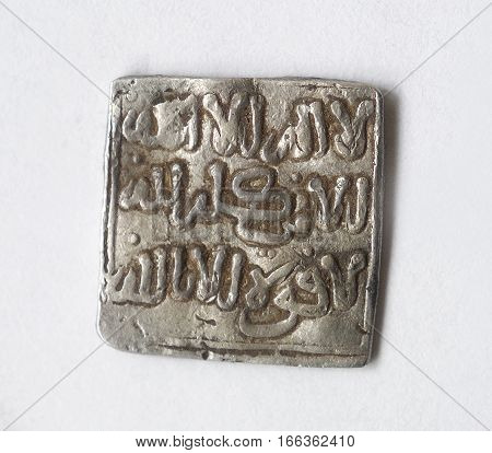 Hispanic currency medieval Arabic Almohades mahdy isolated on a white background