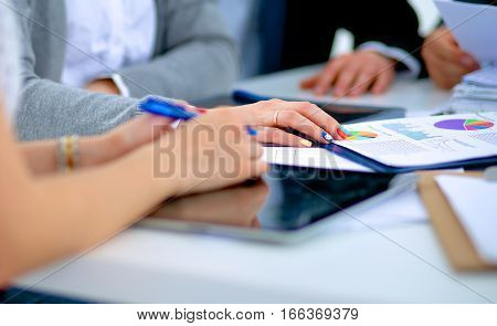 Business people sitting and discussing at business meeting