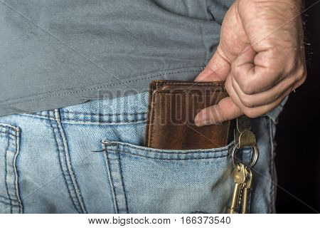 Man's Hand Taking Wallet