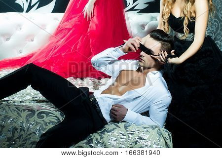 Attractive Young Man With Two Ladies