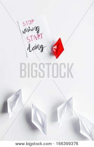 choice concept paper boats on white background top view.