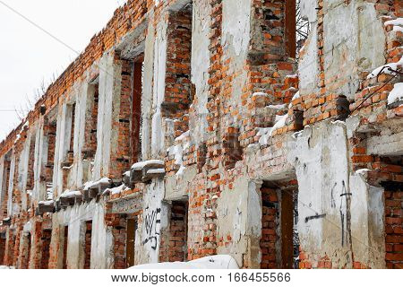 Old Building Falling Apart With Broken Windows, Walls Covered With Cracks And Scratches