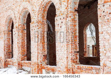 Old Building Falling Apart With Broken Windows, Walls Covered With Cracks And Scratches