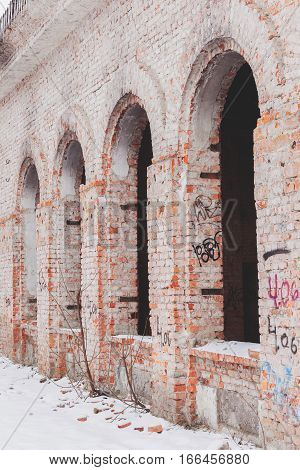 Old Building Falling Apart With Broken Windows, Walls Covered With Cracks And Scratches