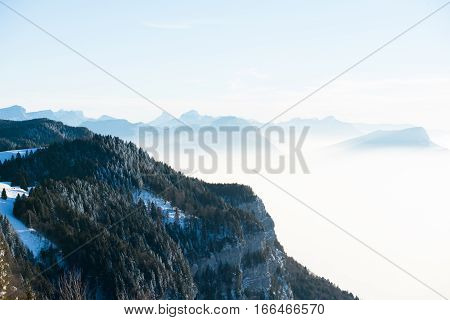 beautiful french alps winter panoramic aerial view landscape with a fantastic blue haze cloudy mountain background