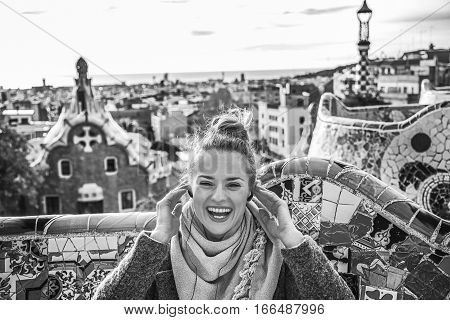 Happy Tourist Woman In Barcelona, Spain Sitting On Bench