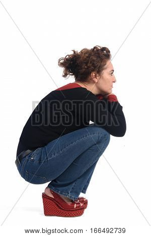A Woman crouching on a white background