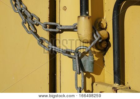 Padlock and chain on a door in the port of Magdeburg