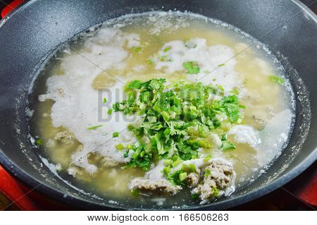 hot boiled rice with minced pork dressing parsley on steamed pot