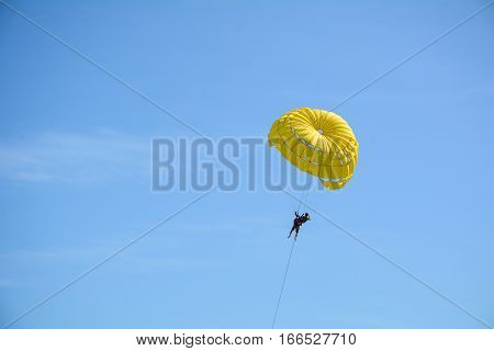 People Playing Parasailing In Phuket, Thailand.