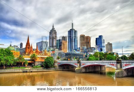 Skyline of Melbourne along the Yarra River and Princes Bridge in Australia