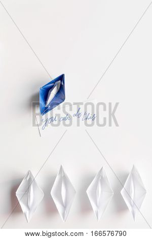 choice concept paper boats on white background top view.