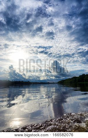 Beautiful sky and reflection on the Amazon River near Leticia Colombia