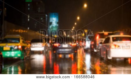 Car and traffic jam concept - Blurred of car brake light with traffic jam in night