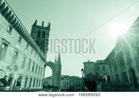 Montpellier, France - September 29, 2016: Gren split tone image sun hits entrance and walls of University of Montpellier, Faculty of Medicine buildings