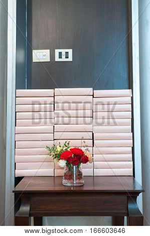 The beautiful red roses on wooden table