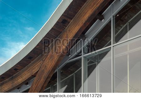 MINSK BELARUS - January 15 2017: Sports complex Olympic reserve. Pool National Olympic Training Center in athletics in Minsk Belarus. Detail of building facade. Interfacing of wooden structure glued elements. 