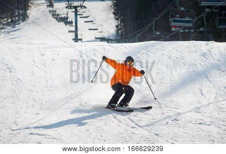 Skier Skiing Downhill In The Moment Of Falling