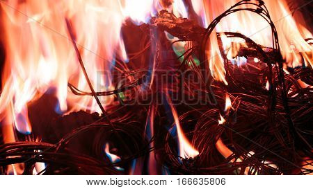 wires on fire. Firing winding insulation of electrical wiring in the fire close-up