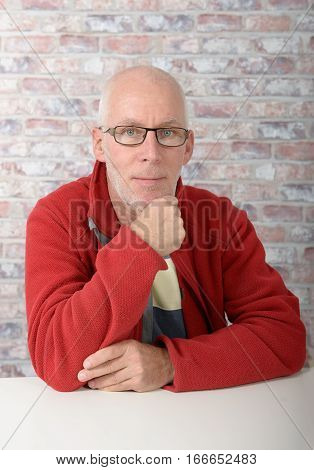 Portrait of a mature man with a red jacket