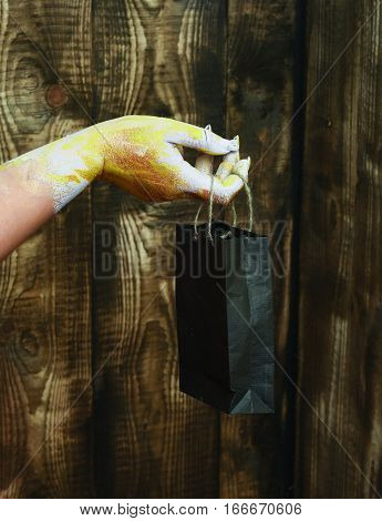 Female Hand Holding Package