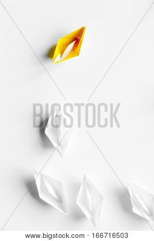 choice concept paper boats on white background top view.