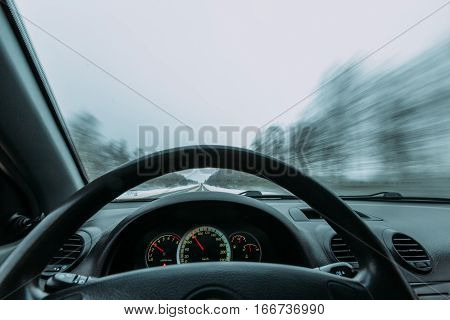 Riding behind the wheel of a car in winter. first-person view
