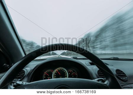Riding behind the wheel of a car in winter. first-person view