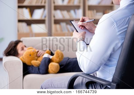 Woman with bear toy during psychologist visit