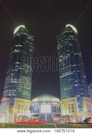 SHANGHAI CHINA - OCTOBER 31, 2016: Grand Gateaway 66 shopping mall. Grand Gateaway was completed in 2005 and are currently the 4th tallest twin towers in the world