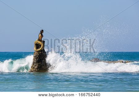 NGAPALI, MYANMAR - DECEMBER 14, 2016 : mermaid statue of Ngapali Beach near Thandwe at Rakhine state in Myanmar