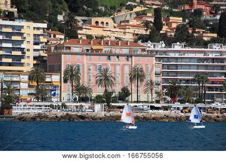 MENTON, FRANCE - APRIL 30, 2015: Menton cityscape and harbour on April 30, 2015 in Menton, France. It is a popular tourist resort on French Riviera.