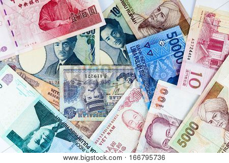 Multi currency note indicating world economy and critical fuel price