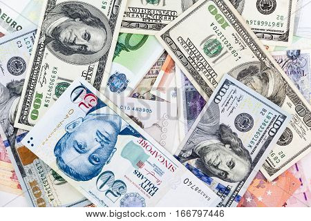 Multi currency note indicating world economy and critical fuel price