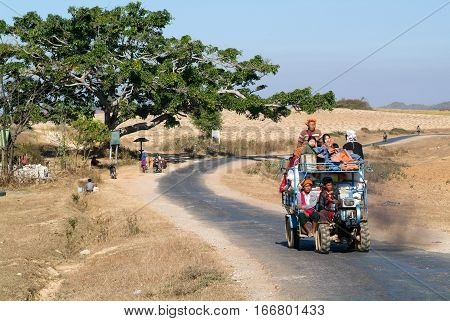 Pindaya Myanmar - 13 January 2010: people crammed on a tractor in the countryside of Pindaya on Myanmar