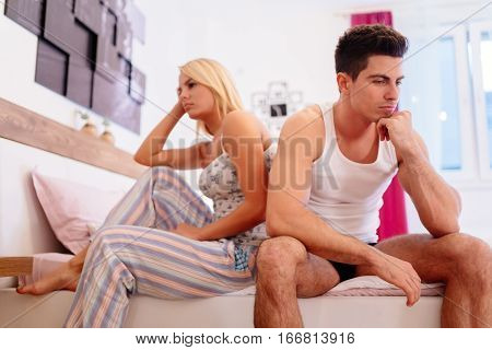 Worried Couple Having Problems In Bedroom