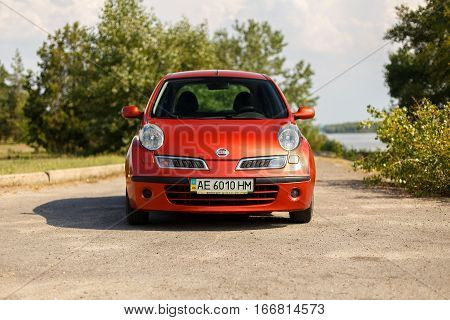 DNIPRO UKRAINE - AUGUST 10 2016: NISSAN MICRA NEAR THE RIVER