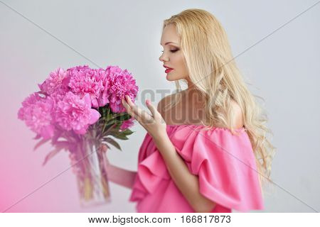 Portrait young pregnant woman with a flower