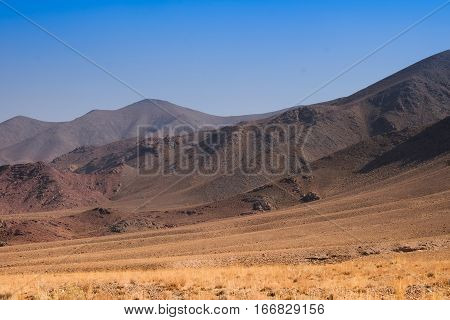 The hill opposit of abyaneh village It 's traditinal and historic village in Iran It's a desert.