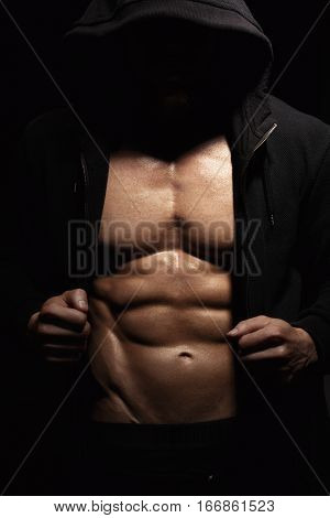 Athletic Strong Sexual Man Abs Six Pack Muscles Bodybuiding And Fitness Concept. Studio shot, Low key