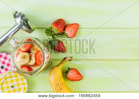 Banana and strawberry smoothie, inredients, copy space