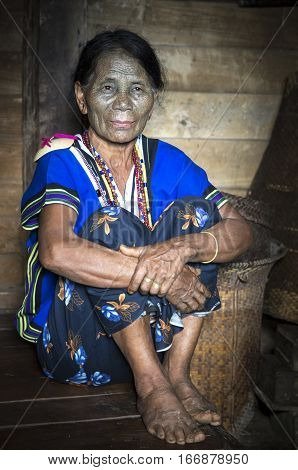 Chin region Myanmar November 11 2014: Daai tribe chin lady in her kitchen