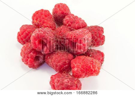 tasty and juicy red raspberries isolated on white background