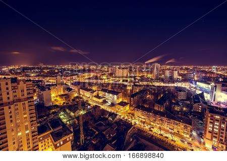 Voronezh downtown. Night cityscape from rooftop. Modern houses, hotels, streets, night lights