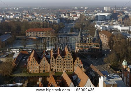 LUBECK, GERMANY - DECEMBER 30, 2016: Cityscape viewed from the tower of St. Peter church. Because of its extensive Brick Gothic architecture, the city is listed by UNESCO as a World Heritage Site