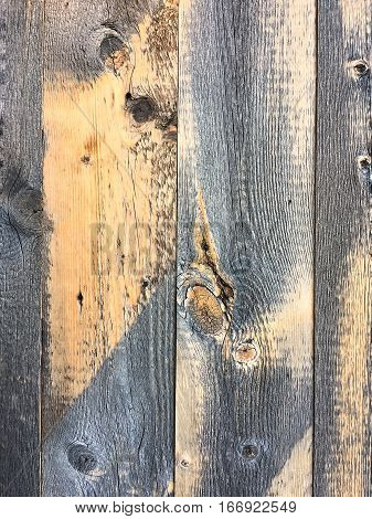 Old textured wood boards with aged discoloration