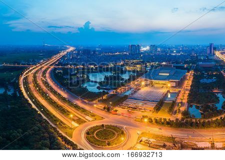 Aerial Skyline View Of Hanoi Cityscape At Twilight. Thang Long Freeway And Pham Hung Street