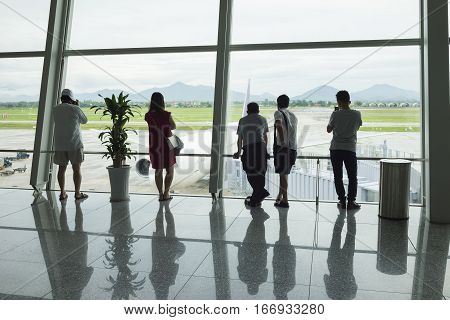 Airline Passengers Silhouettes At Airport