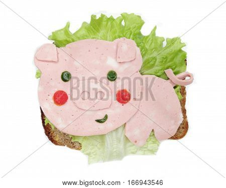 creative sandwich with cheese and salami pig form