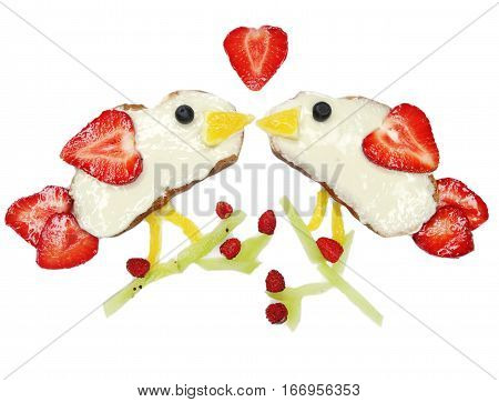 creative breakfast food with fruit and chocolate sweet cream on bread